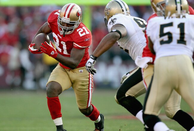 SAN FRANCISCO, CA - JANUARY 14:  Frank Gore #21 of the San Francisco 49ers carries the ball against the New Orleans Saints during the third quarter of the NFC Divisional playoff game at Candlestick Park on January 14, 2012 in San Francisco, California.  (Photo by Jed Jacobsohn/Getty Images)