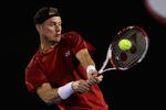 MELBOURNE, AUSTRALIA - JANUARY 19:  Lleyton Hewitt of Australia plays a backhand in his second round match against Andy Roddick of the USA during day four of the 2012 Australian Open at Melbourne Park on January 19, 2012 in Melbourne, Australia.  (Photo by Quinn Rooney/Getty Images)