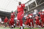 GLENDALE, AZ - DECEMBER 18:  Offensive tackle Brandon Keith #72 (C) of the Arizona Cardinals leads teammates off the field following warm ups to the NFL game against the Cleveland Browns at the University of Phoenix Stadium on December 18, 2011 in Glendale, Arizona.  (Photo by Christian Petersen/Getty Images)