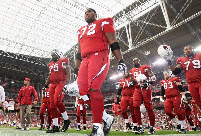 GLENDALE, AZ - DECEMBER 18:  Offensive tackle Brandon Keith #72 (C) of the Arizona Cardinals leads teammates off the field following warm ups to the NFL game against the Cleveland Browns at the University of Phoenix Stadium on December 18, 2011 in Glendale, Arizona.  (Photo by Christian Petersen/Getty Images)