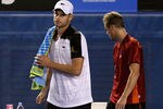 MELBOURNE, AUSTRALIA - JANUARY 19:  Andy Roddick (L) of the USA walks from the court after retiring in his second round match against Lleyton Hewitt of Australia during day four of the 2012 Australian Open at Melbourne Park on January 19, 2012 in Melbourne, Australia.  (Photo by Quinn Rooney/Getty Images)