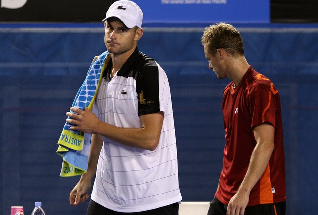 MELBOURNE, AUSTRALIA - JANUARY 19:  Andy Roddick (L) of the USA walks from the court after retiring in his second round match against Lleyton Hewitt of Australia during day four of the 2012 Australian Open at Melbourne Park on January 19, 2012 in Melbourne, Australia.  (Photo by Quinn Rooney/Getty Images)