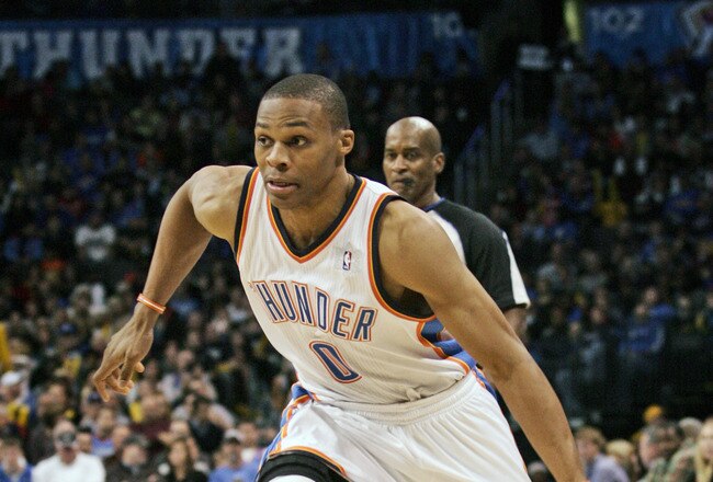 OKLAHOMA CITY, OK -DECEMBER 25:  Russell Westbrook #0 of the Oklahoma City Thunder drives inside during the NBA season opening game against the Orlando Magic December 25, 2011 at the Chesapeake Energy Arena in Oklahoma City, Oklahoma.  Oklahoma City defeated Orlando 97-89. NOTE TO USER: User expressly acknowledges and agrees that, by downloading and or using this Photograph, user is consenting to the terms and conditions of the Getty Images License Agreement.  (Photo by Brett Deering/Getty Images)
