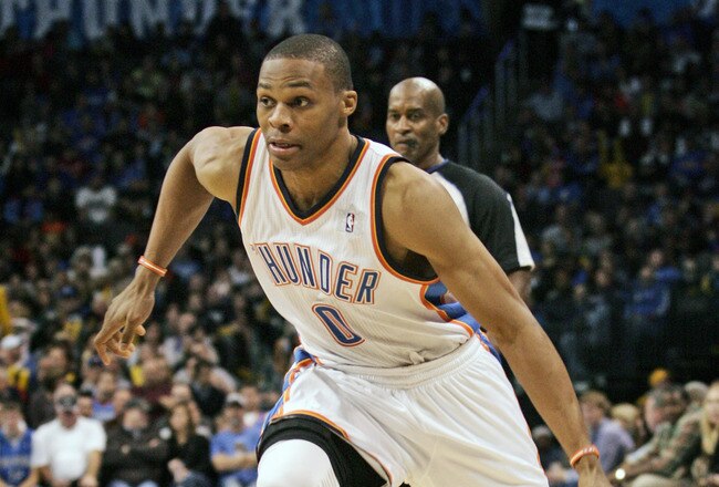 OKLAHOMA CITY, OK -DECEMBER 25:  Russell Westbrook #0 of the Oklahoma City Thunder drives inside during the NBA season opening game against the Orlando Magic December 25, 2011 at the Chesapeake Energy Arena in Oklahoma City, Oklahoma.  Oklahoma City defeated Orlando 97-89. NOTE TO USER: User expressly acknowledges and agrees that, by downloading and or using this Photograph, user is consenting to the terms and conditions of the Getty Images License Agreement.  (Photo by Brett Deering/Getty Images)