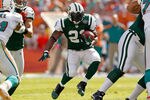 MIAMI GARDENS, FL - JANUARY 01:  LaDainian Tomlinson #21 of the New York Jets rushes during a game against the Miami Dolphins at Sun Life Stadium on January 1, 2012 in Miami Gardens, Florida.  (Photo by Mike Ehrmann/Getty Images)