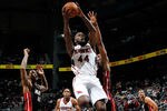 ATLANTA, GA - JANUARY 05:  Ivan Johnson #44 of the Atlanta Hawks drives against Udonis Haslem #40 and Chris Bosh #1 of the Miami Heat at Philips Arena on January 5, 2012 in Atlanta, Georgia.  NOTE TO USER: User expressly acknowledges and agrees that, by downloading and or using this photograph, User is consenting to the terms and conditions of the Getty Images License Agreement.  (Photo by Kevin C. Cox/Getty Images)