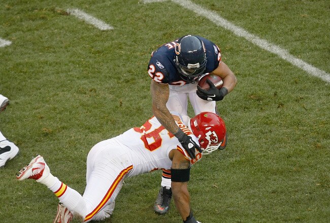 CHICAGO, IL - DECEMBER 4: Matt Forte #22 of the Chicago Bears is hit by  Derrick Johnson #56 of the Kansas City Chiefs at Soldier Field on December 4, 2011 in Chicago, Illinois. (Photo by Scott Boehm/Getty Images)