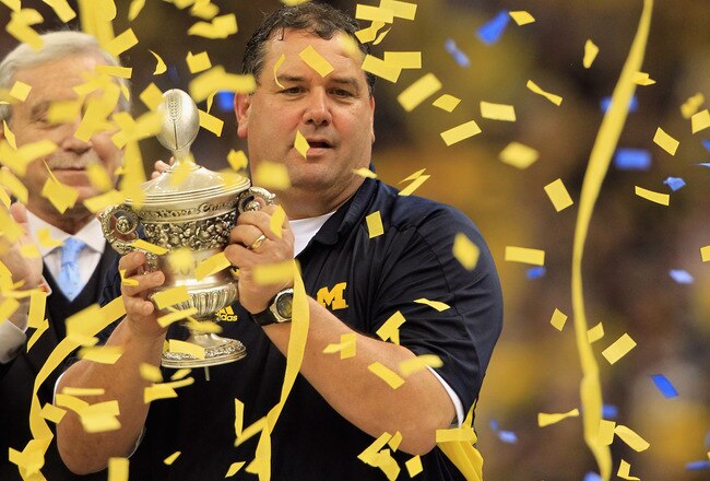 NEW ORLEANS, LA - JANUARY 03:  Head coach Brady Hoke of the Michigan Wolverines celebrates with the trophy after Michigan won 23-20 in overtime against the Virginia Tech Hokies during the Allstate Sugar Bowl at Mercedes-Benz Superdome on January 3, 2012 in New Orleans, Louisiana.  (Photo by Matthew Stockman/Getty Images)
