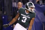 INDIANAPOLIS, IN - DECEMBER 03:  B.J. Cunningham #3 of the Michigan State Spartans scores on a 44-yard touchdown reception in the third quarter against the Wisconsin Badgers during the Big 10 Conference Championship Game at Lucas Oil Stadium on December 3, 2011 in Indianapolis, Indiana.  (Photo by Andy Lyons/Getty Images)