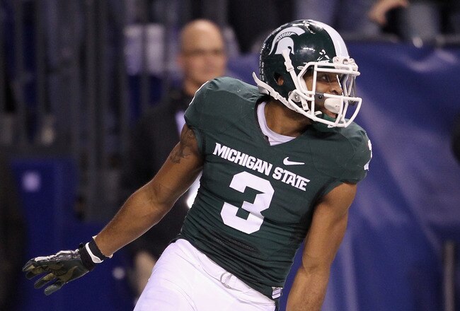 INDIANAPOLIS, IN - DECEMBER 03:  B.J. Cunningham #3 of the Michigan State Spartans scores on a 44-yard touchdown reception in the third quarter against the Wisconsin Badgers during the Big 10 Conference Championship Game at Lucas Oil Stadium on December 3, 2011 in Indianapolis, Indiana.  (Photo by Andy Lyons/Getty Images)