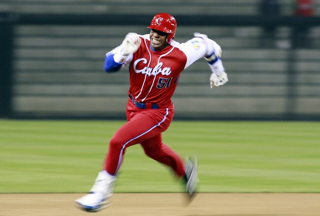SAN DIEGO - MARCH 18: Yoennis Cespedes #51 of Cuba runs to third base after hitting into the corner of the outfield againts Japan during the 2009 World Baseball Classic Round 2 Pool 1 Game 5 on March 18, 2009 at Petco Park in San Diego, California.  (Photo by Jeff Bottari/Getty Images)