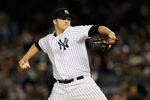 NEW YORK, NY - OCTOBER 06:  Phil Hughes #65 of the New York Yankees throws a pitch against the Detroit Tigers during Game Five of the American League Championship Series at Yankee Stadium on October 6, 2011 in the Bronx borough of New York City.  (Photo by Patrick McDermott/Getty Images)