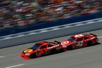 TALLADEGA, AL - APRIL 17:  Jamie McMurray, driver of the #1 Bass Pro Shops/Tracker Boats Chevrolet, leads Juan Pablo Montoya, driver of the #42 Target Chevrolet, during the NASCAR Sprint Cup Series Aaron's 499 at Talladega Superspeedway on April 17, 2011 in Talladega, Alabama.  (Photo by Jason Smith/Getty Images for NASCAR)