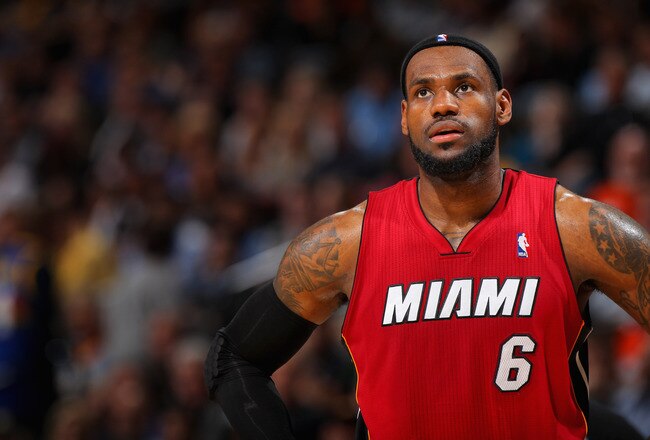 DENVER, CO - JANUARY 13:  LeBron James #6 of the Miami Heat looks on during a break in the action against the Denver Nuggets at the Pepsi Center on January 13, 2012 in Denver, Colorado. The Nuggets defeated the Heat 117-104. NOTE TO USER: User expressly acknowledges and agrees that, by downloading and or using this photograph, User is consenting to the terms and conditions of the Getty Images License Agreement.  (Photo by Doug Pensinger/Getty Images)