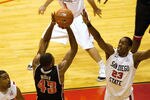 SAN DIEGO, CA - JANUARY 14 - Mike Moser #43 of the UNLV Runnin' Rebels shoots over Deshawn Stephens #23 of the San Diego State Aztecs during the first half of the game at Viejas Arena on January 14, 2012 in San Diego, California. (Photo by Kent C. Horner/Getty Images)