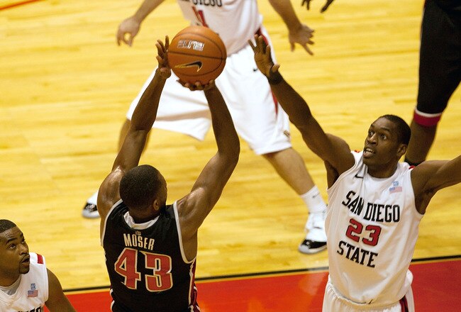 SAN DIEGO, CA - JANUARY 14 - Mike Moser #43 of the UNLV Runnin' Rebels shoots over Deshawn Stephens #23 of the San Diego State Aztecs during the first half of the game at Viejas Arena on January 14, 2012 in San Diego, California. (Photo by Kent C. Horner/Getty Images)