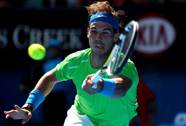 MELBOURNE, AUSTRALIA - JANUARY 18:  Rafael Nadal of Spain plays a forehand in his second round match against Tommy Haas of Germany during day three of the 2012 Australian Open at Melbourne Park on January 18, 2012 in Melbourne, Australia.  (Photo by Clive Brunskill/Getty Images)