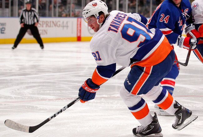 NEW YORK, NY - DECEMBER 26:  John Tavares #91 of the New York Islanders skates in an NHL hockey game against the New York Rangers at Madison Square Garden on December 26, 2011 in New York City.  (Photo by Paul Bereswill/Getty Images)