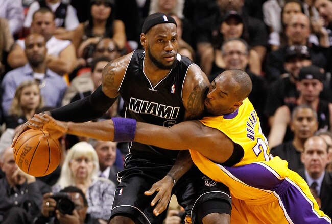 MIAMI, FL - JANUARY 19:  LeBron James #6 of the Miami Heat is guarded by Kobe Bryant #24 of the Los Angeles Lakers during a game at American Airlines Arena on January 19, 2012 in Miami, Florida. NOTE TO USER: User expressly acknowledges and agrees that, by downloading and/or using this Photograph, User is consenting to the terms and conditions of the Getty Images License Agreement.  (Photo by Mike Ehrmann/Getty Images)