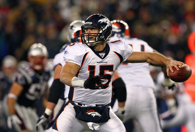 FOXBORO, MA - JANUARY 14:  Tim Tebow #15 of the Denver Broncos throws a pass against the New England Patriots during their AFC Divisional Playoff Game at Gillette Stadium on January 14, 2012 in Foxboro, Massachusetts.  (Photo by Al Bello/Getty Images)