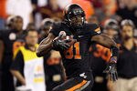 GLENDALE, AZ - JANUARY 02:  Justin Blackmon #81 of the Oklahoma State Cowboys runs for yards after the catch against the Stanford Cardinal during the Tostitos Fiesta Bowl on January 2, 2012 at University of Phoenix Stadium in Glendale, Arizona.  (Photo by Christian Petersen/Getty Images)