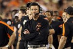GLENDALE, AZ - JANUARY 02:  Head coach Mike Gundy of the Oklahoma State Cowboys looks on against the Stanford Cardinal during the Tostitos Fiesta Bowl on January 2, 2012 at University of Phoenix Stadium in Glendale, Arizona.  (Photo by Christian Petersen/Getty Images)