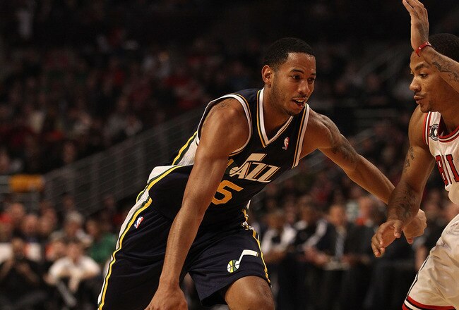 CHICAGO, IL - MARCH 12: Devin Harris #5 of the Utah Jazz drives against Derrick Rose #1 of the Chicago Bulls at the United Center on March 12, 2011 in Chicago, Illinois. The Bulls defeated the Jazz 118-100. NOTE TO USER: User expressly acknowledges and agrees that, by downloading and/or using this photograph, User is consenting to the terms and conditions of the Getty Images License Agreement. (Photo by Jonathan Daniel/Getty Images)