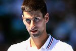 MELBOURNE, AUSTRALIA - JANUARY 19:  Novak Djokovic of Serbia looks on in his second round match against Santiago Giraldo of Columbia during day four of the 2012 Australian Open at Melbourne Park on January 19, 2012 in Melbourne, Australia.  (Photo by Scott Barbour/Getty Images)