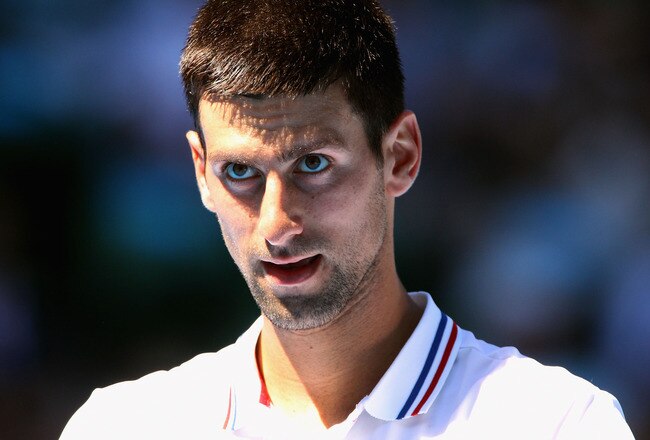 MELBOURNE, AUSTRALIA - JANUARY 19:  Novak Djokovic of Serbia looks on in his second round match against Santiago Giraldo of Columbia during day four of the 2012 Australian Open at Melbourne Park on January 19, 2012 in Melbourne, Australia.  (Photo by Scott Barbour/Getty Images)