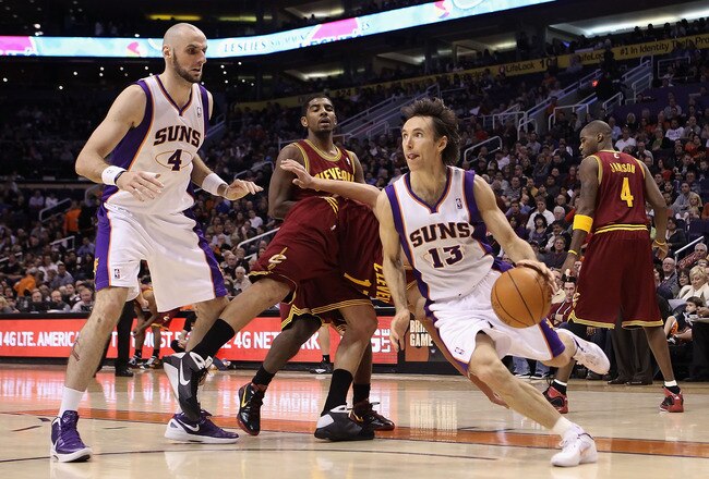 PHOENIX, AZ - JANUARY 12:  Steve Nash #13 of the Phoenix Suns handles the ball during the NBA game against the Cleveland Cavaliers at US Airways Center on January 12, 2012 in Phoenix, Arizona. The Cavaliers defeated the Suns 101-90. NOTE TO USER: User expressly acknowledges and agrees that, by downloading and or using this photograph, User is consenting to the terms and conditions of the Getty Images License Agreement.  (Photo by Christian Petersen/Getty Images)