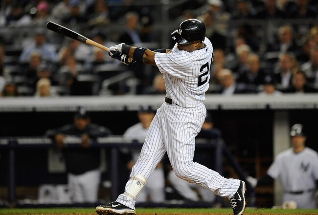 NEW YORK, NY - OCTOBER 06:  Robinson Cano #24 of the New York Yankees hits a solo home run in the bottom of the fifht inning against the Detroit Tigers during Game Five of the American League Championship Series at Yankee Stadium on October 6, 2011 in the Bronx borough of New York City.  (Photo by Patrick McDermott/Getty Images)