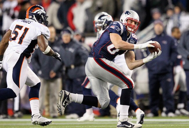 FOXBORO, MA - JANUARY 14:  Rob Gronkowski #87 of the New England Patriots makes a reception against the Denver Broncos during their AFC Divisional Playoff Game at Gillette Stadium on January 14, 2012 in Foxboro, Massachusetts.  (Photo by Jim Rogash/Getty Images)