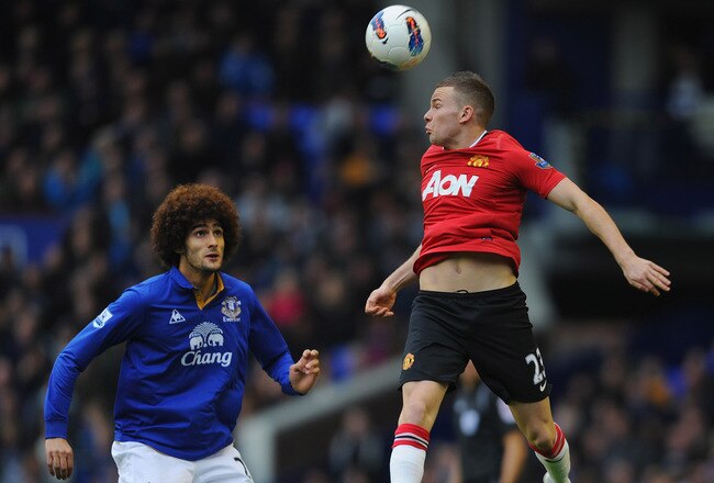 LIVERPOOL, ENGLAND - OCTOBER 29:  Marouane Fellaini of Everton in action with Tom Cleverley of Manchester United during the Barclays Premier League match between Everton and Manchester United at Goodison Park on October 29, 2011 in Liverpool, England.  (Photo by Michael Regan/Getty Images)