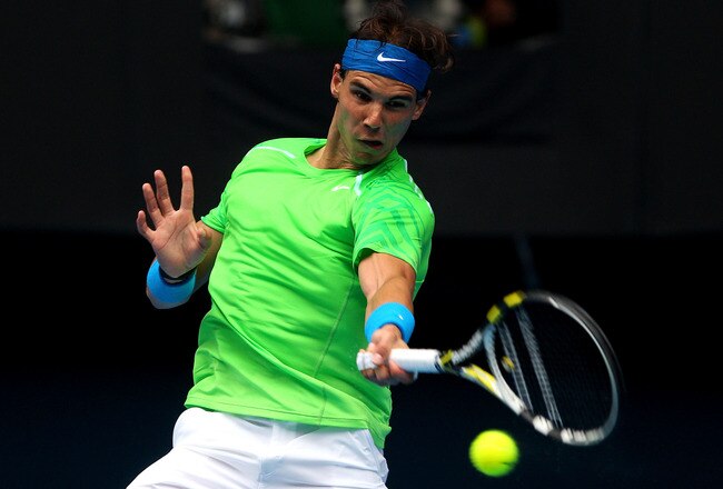 MELBOURNE, AUSTRALIA - JANUARY 20:  Rafael Nadal of Spain plays a forehand in his third round match against Lukas Lacko of Slovakia during day five of the 2012 Australian Open at Melbourne Park on January 20, 2012 in Melbourne, Australia.  (Photo by Cameron Spencer/Getty Images)