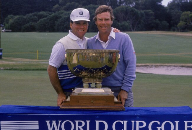 American golfers Ben Crenshaw (right) and Mark McCumber with their trophy after winning the WGC-World Cup golf tournament, Melbourne, 1988. (Photo by David Cannon/Getty Images)