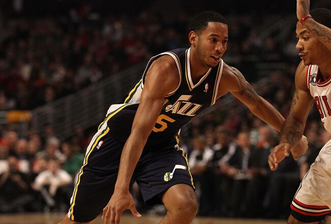 CHICAGO, IL - MARCH 12: Devin Harris #5 of the Utah Jazz drives against Derrick Rose #1 of the Chicago Bulls at the United Center on March 12, 2011 in Chicago, Illinois. The Bulls defeated the Jazz 118-100. NOTE TO USER: User expressly acknowledges and agrees that, by downloading and/or using this photograph, User is consenting to the terms and conditions of the Getty Images License Agreement. (Photo by Jonathan Daniel/Getty Images)