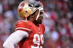 SAN FRANCISCO, CA - JANUARY 14:  Aldon Smith #99 of the San Francisco 49ers looks on during the NFC Divisional playoff game against the New Orleans Saints at Candlestick Park on January 14, 2012 in San Francisco, California.  (Photo by Thearon W. Henderson/Getty Images)