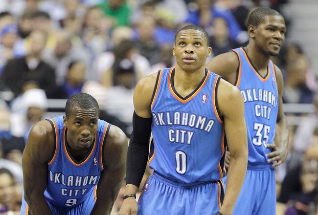 WASHINGTON, DC - MARCH 14: Russell Westbrook #0 of the Oklahoma City Thunder stands with teammates Serge Ibaka #9 and Kevin Durant #35 during the first half against the Washington Wizardsat the Verizon Center on March 14, 2011 in Washington, DC. NOTE TO USER: User expressly acknowledges and agrees that, by downloading and/or using this Photograph, User is consenting to the terms and conditions of the Getty Images License Agreement.  (Photo by Rob Carr/Getty Images)