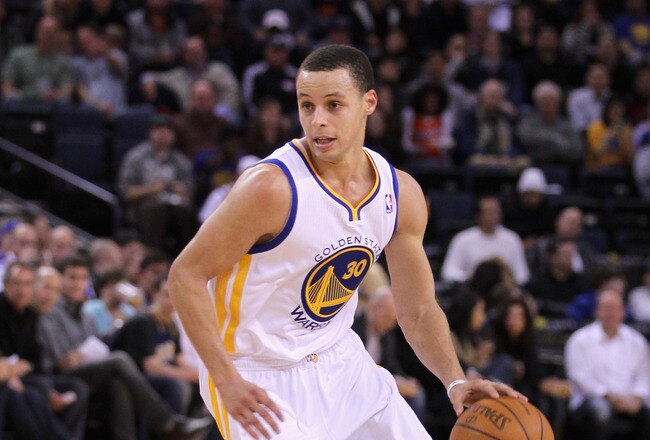 OAKLAND, CA - MARCH 25:  Stephen Curry #30 of the Golden State Warriors in action against the Toronto Raptors at Oracle Arena on March 25, 2011 in Oakland, California. NOTE TO USER: User expressly acknowledges and agrees that, by downloading and or using this photograph, User is consenting to the terms and conditions of the Getty Images License Agreement.  (Photo by Ezra Shaw/Getty Images)