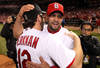 ST LOUIS, MO - OCTOBER 28:  Albert Pujols #5 (R) and Lance Berkman #12 of the St. Louis Cardinals celebrate after defeating the Texas Rangers 6-2 in Game Seven of the MLB World Series at Busch Stadium on October 28, 2011 in St Louis, Missouri.  (Photo by Jamie Squire/Getty Images)