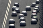 DAYTONA BEACH, FL - JANUARY 14:  A group of cars race during Daytona Preseason Thunder at Daytona International Speedway on January 14, 2012 in Daytona Beach, Florida.  (Photo by Jerry Markland/Getty Images for NASCAR)