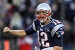 FOXBORO, MA - JANUARY 01:   Tom Brady #12 of the New England Patriots celebrates a touchdown by teammate BenJarvus Green-Ellis in the fourth quarter against the Buffalo Bills on January 1, 2012 at Gillette Stadium in Foxboro, Massachusetts.  (Photo by Elsa/Getty Images)