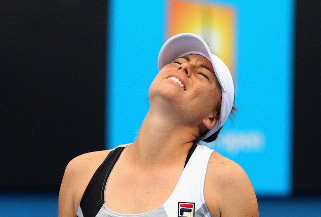 MELBOURNE, AUSTRALIA - JANUARY 21:  Vera Zvonareva of Russia reacts after a shot in her third round match against Ekaterina Makarova of Russia during day six of the 2012 Australian Open at Melbourne Park on January 21, 2012 in Melbourne, Australia.  (Photo by Cameron Spencer/Getty Images)