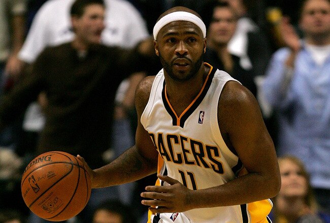 INDIANAPOLIS - NOVEMBER 23:  Jamaal Tinsley #11 of the Indiana Pacers brings the ball down court against the Dallas Mavericks at Conseco Fieldhouse November 23, 2007 in Indianapolis, Indiana.  (Photo by Matthew Stockman/Getty Images)