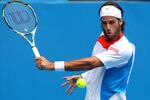 MELBOURNE, AUSTRALIA - JANUARY 20:  Feliciano Lopez of Spain plays a backhand in his third round match against John Isner of the United States of America during day five of the 2012 Australian Open at Melbourne Park on January 20, 2012 in Melbourne, Australia.  (Photo by Lucas Dawson/Getty Images)