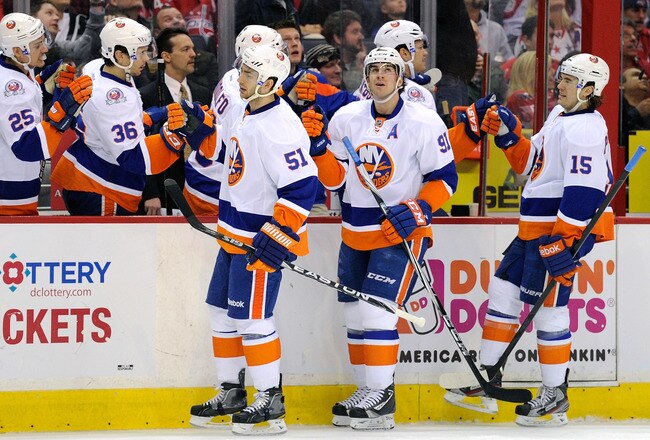 WASHINGTON, DC - JANUARY 17:  John Tavares #91 of the New York Islanders celebrates with teammates after scoring in the first period against the Washington Capitals at the Verizon Center on January 17, 2012 in Washington, DC.  (Photo by Greg Fiume/Getty Images)