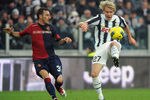 TURIN, ITALY - JANUARY 15:  Milos Krasic (R) of Juventus FC in action against Alessandro Agostini of Cagliari Calcio during the Serie A match between Juventus FC and Cagliari Calcio at Juventus Arena on January 15, 2012 in Turin, Italy.  (Photo by Valerio Pennicino/Getty Images)