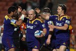 HAMILTON, NEW ZEALAND - MAY 07: Jason Rutledge of the Highlanders celebrates with Alando Soakai and Ben Smith after scoring during the round 12 Super Rugby match between the Chiefs and the Highlanders at Waikato Stadium on May 7, 2011 in Hamilton, New Zealand.  (Photo by Hannah Johnston/Getty Images)