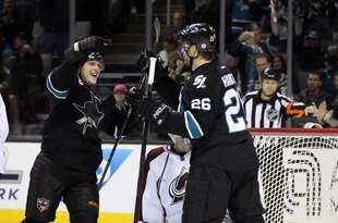 SAN JOSE, CA - DECEMBER 15:  Jamie McGinn #64 of the San Jose Sharks congratulates Michal Handzus #26 of the San Jose Sharks after Handzus scored a goal against the Colorado Avalanche at HP Pavilion at San Jose on December 15, 2011 in San Jose, California.  (Photo by Ezra Shaw/Getty Images)