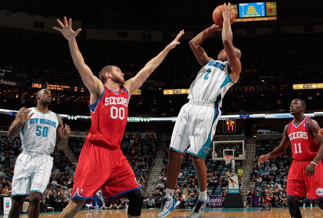 NEW ORLEANS, LA - JANUARY 04:  Jarrett Jack #2 of the New Orleans Hornets makes a shot over Spencer Hawes #0 of the Philadelphia 76ers at New Orleans Arena on January 4, 2012 in New Orleans, Louisiana.  NOTE TO USER: User expressly acknowledges and agrees that, by downloading and or using this photograph, User is consenting to the terms and conditions of the Getty Images License Agreement.  (Photo by Chris Graythen/Getty Images)